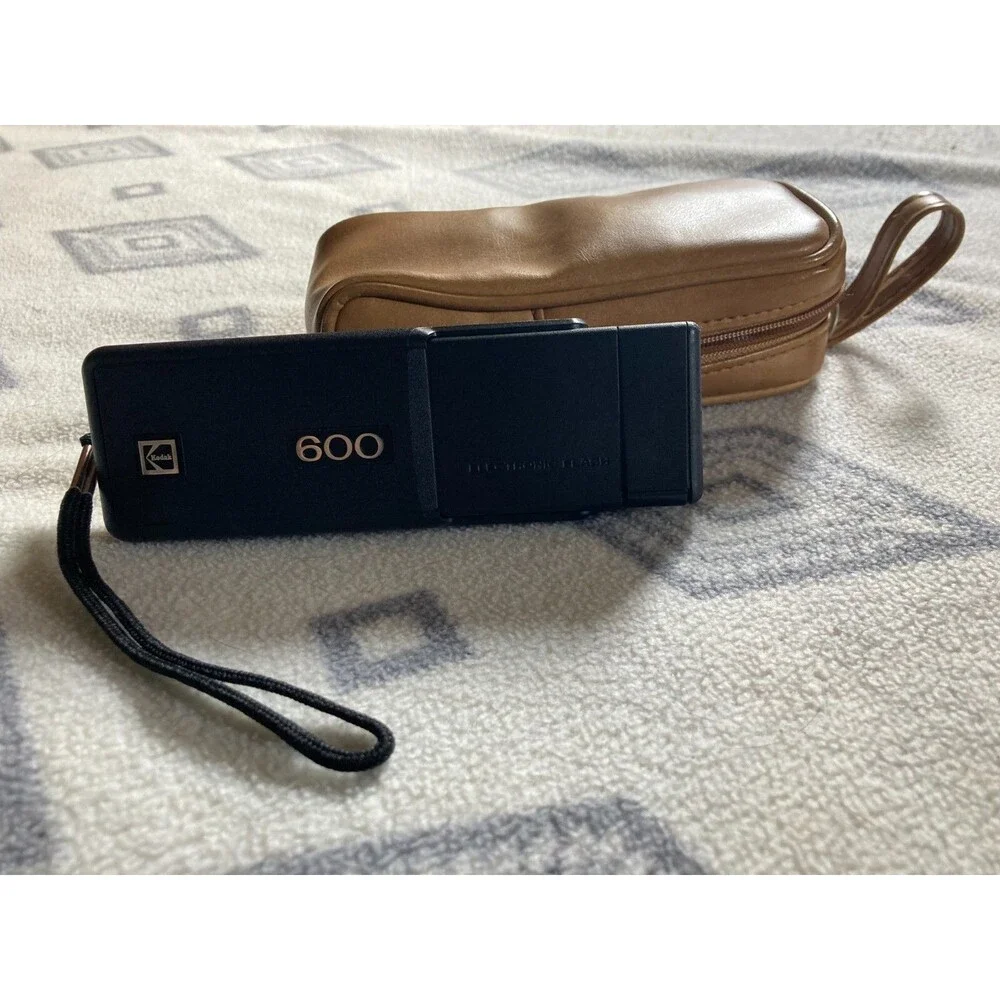 Kodak 600 camera with vintage leather camera case